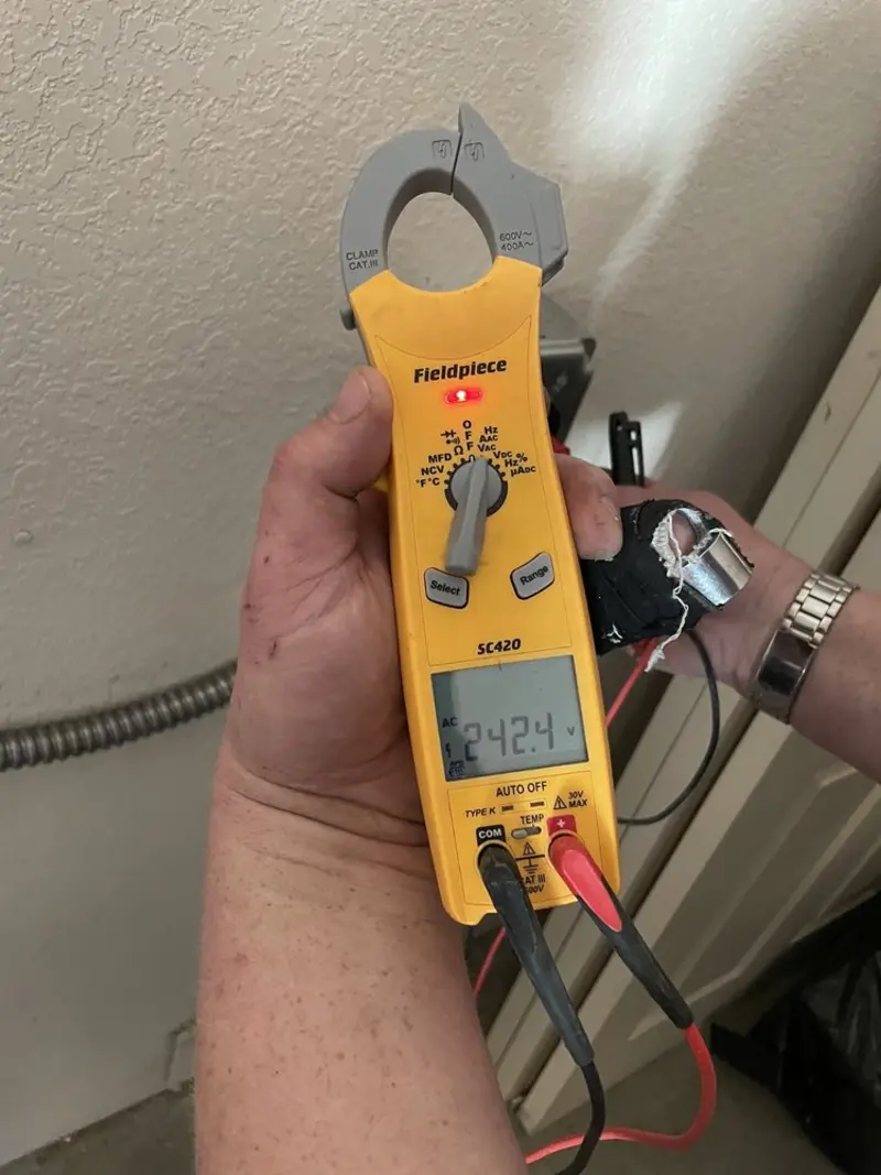Voltage testing with clamp meter during Outlet Installation in Mission Viejo